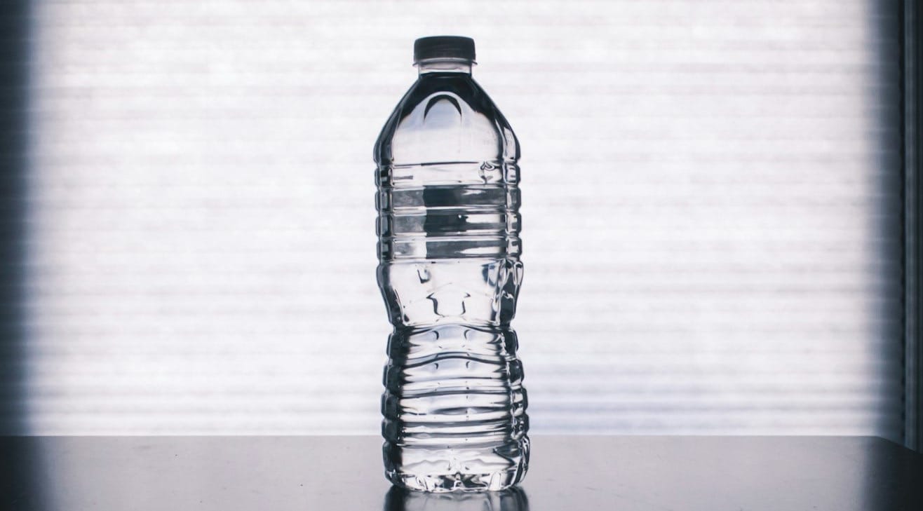 clear drinking bottle filled with water